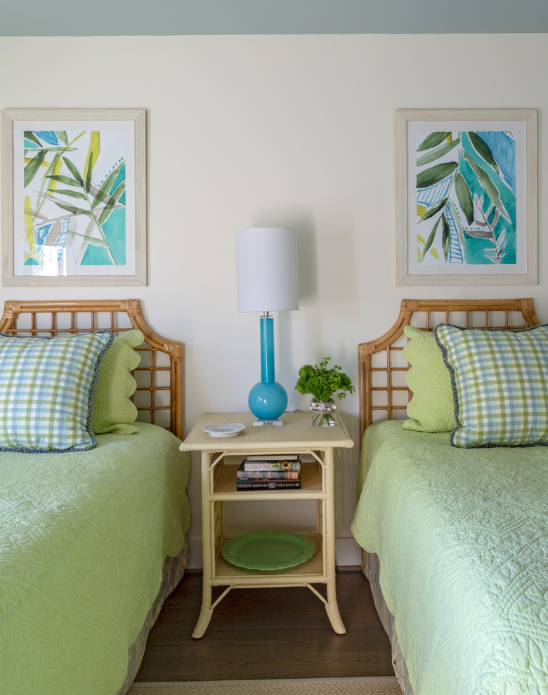 Beach style guest bedroom in Charleston with medium hardwood flooring and brown floors.