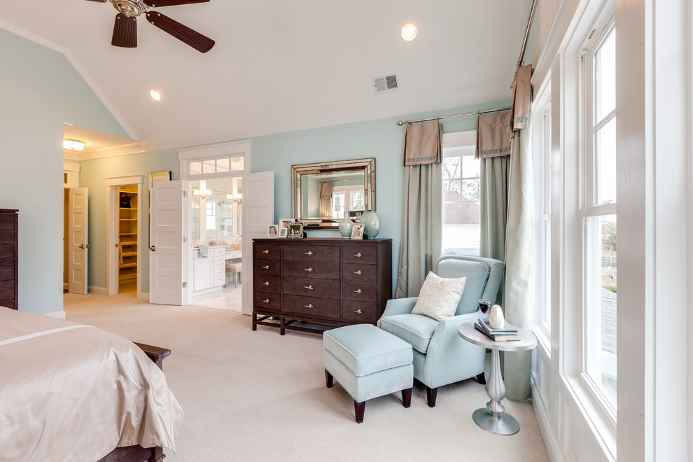 Inspiration for a large coastal master carpeted bedroom remodel in Other with blue walls
