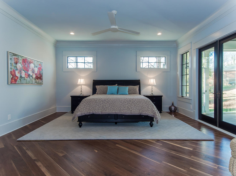 Medium sized classic master bedroom in Raleigh with blue walls, dark hardwood flooring and no fireplace.