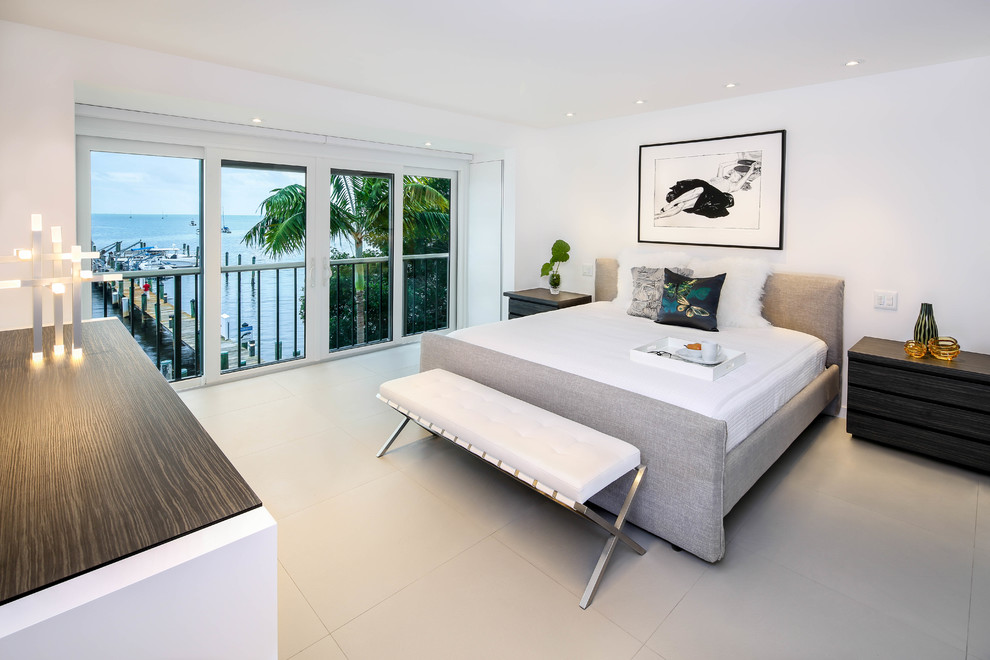 Design ideas for a large modern master bedroom in Miami with white walls, porcelain flooring and no fireplace.