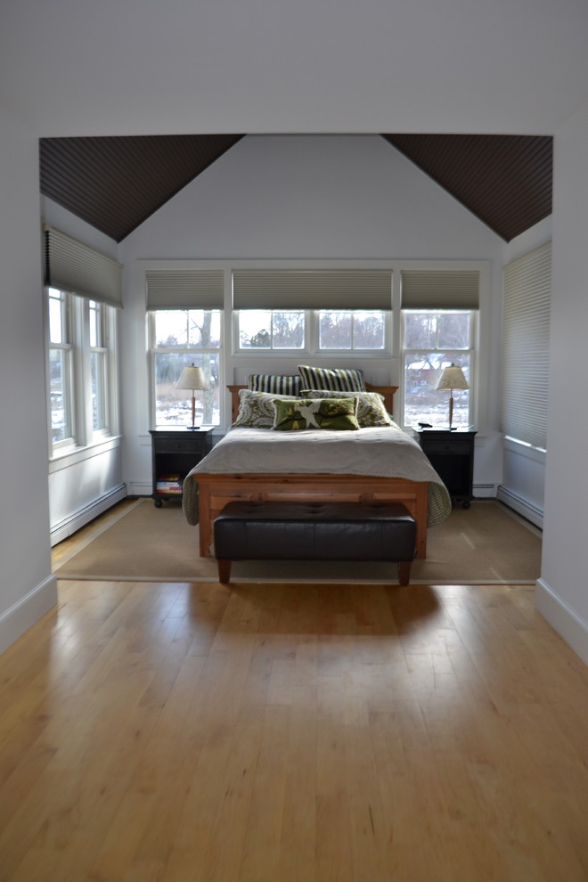 Large elegant master light wood floor bedroom photo in Boston with white walls and no fireplace