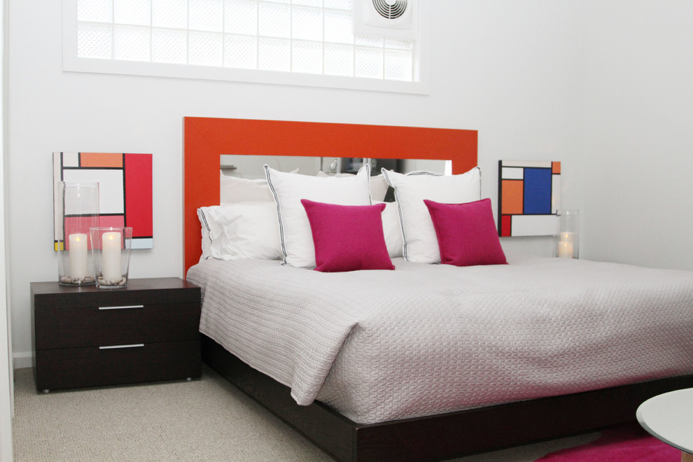 Design ideas for a contemporary grey and pink bedroom in Other with white walls and carpet.