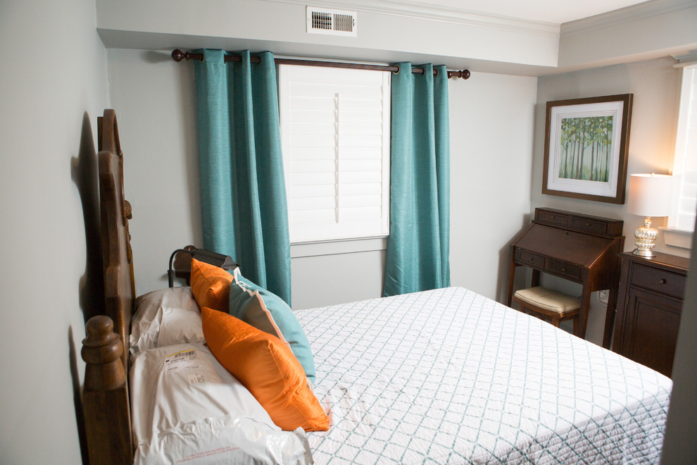 This is an example of a small contemporary guest bedroom in Baltimore with grey walls, light hardwood flooring, no fireplace and brown floors.