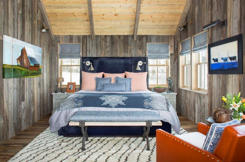 This is an example of a medium sized rustic guest bedroom in Denver with brown walls, dark hardwood flooring and no fireplace.