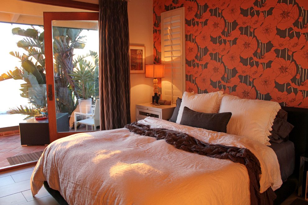 Inspiration for an eclectic bedroom remodel in San Diego with orange walls