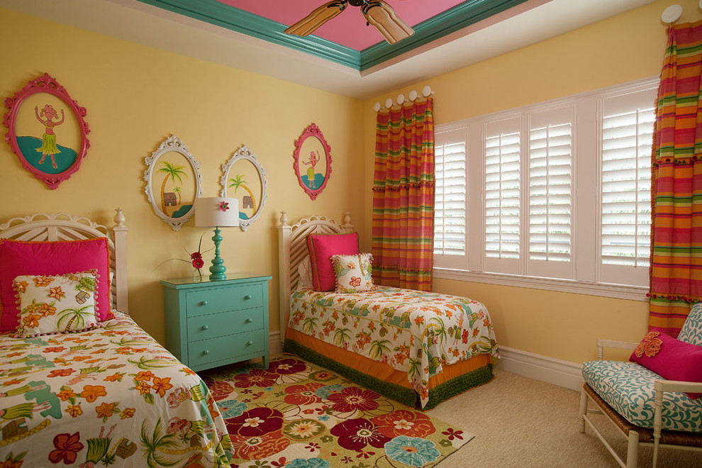 Inspiration for a large tropical guest carpeted and beige floor bedroom remodel in Miami with yellow walls