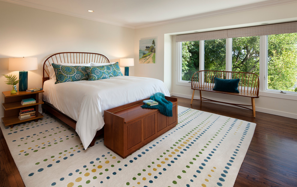 Design ideas for a medium sized classic master bedroom in Santa Barbara with white walls, medium hardwood flooring and a standard fireplace.