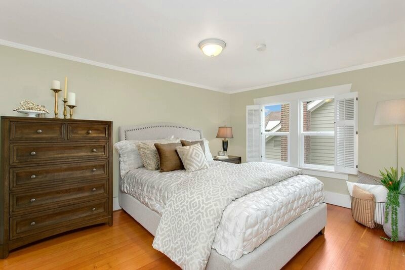 Bedroom - mid-sized craftsman master light wood floor bedroom idea in Seattle with green walls