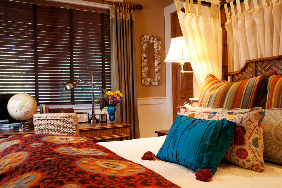 Example of an eclectic bedroom design in Orange County with beige walls
