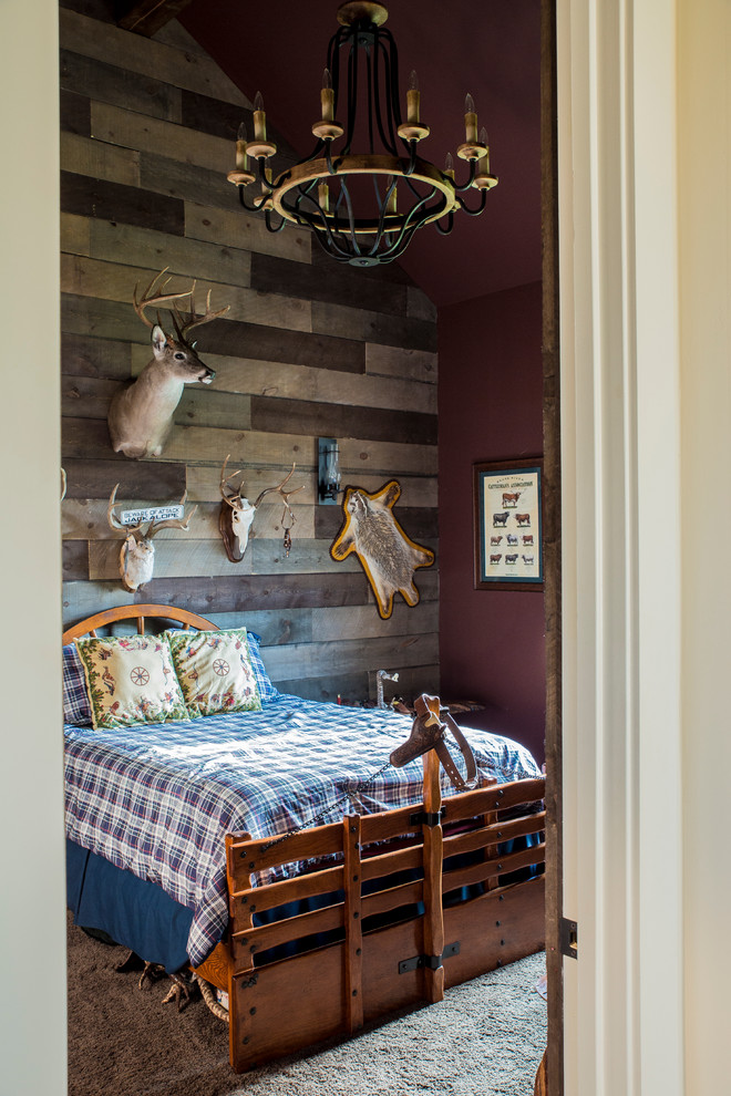 Example of a mid-sized mountain style guest carpeted bedroom design in Austin with beige walls