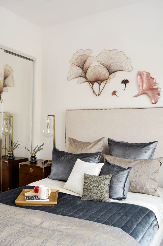 Example of a mid-sized trendy guest carpeted and brown floor bedroom design in Los Angeles with white walls and no fireplace