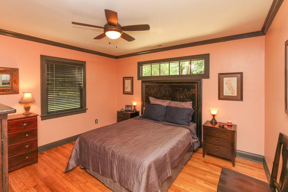 Bedroom - mid-sized craftsman guest light wood floor bedroom idea in Charlotte with pink walls and no fireplace