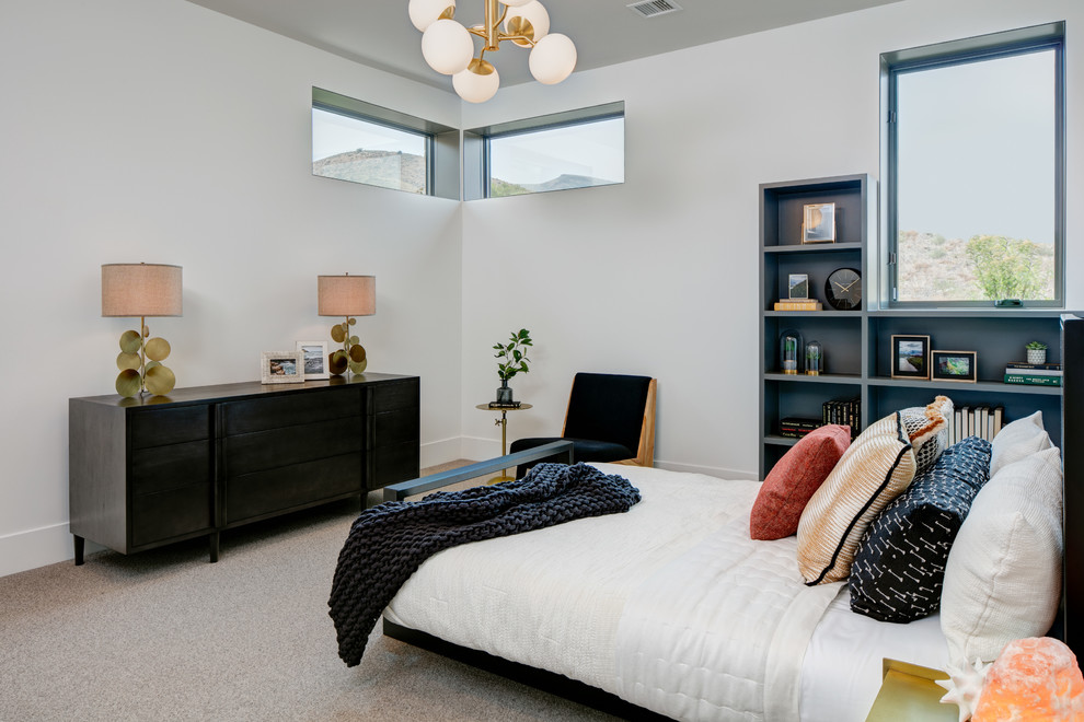 This is an example of a medium sized contemporary guest bedroom in Salt Lake City with white walls, carpet and grey floors.