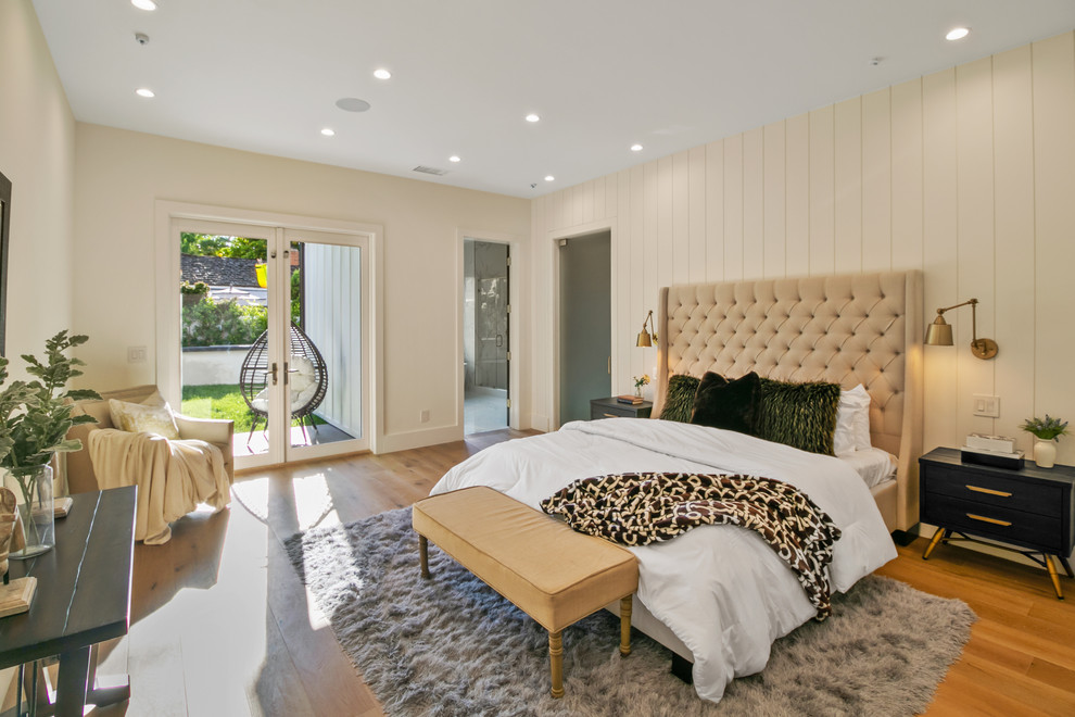Bedroom - transitional master medium tone wood floor and brown floor bedroom idea in Los Angeles with beige walls and no fireplace