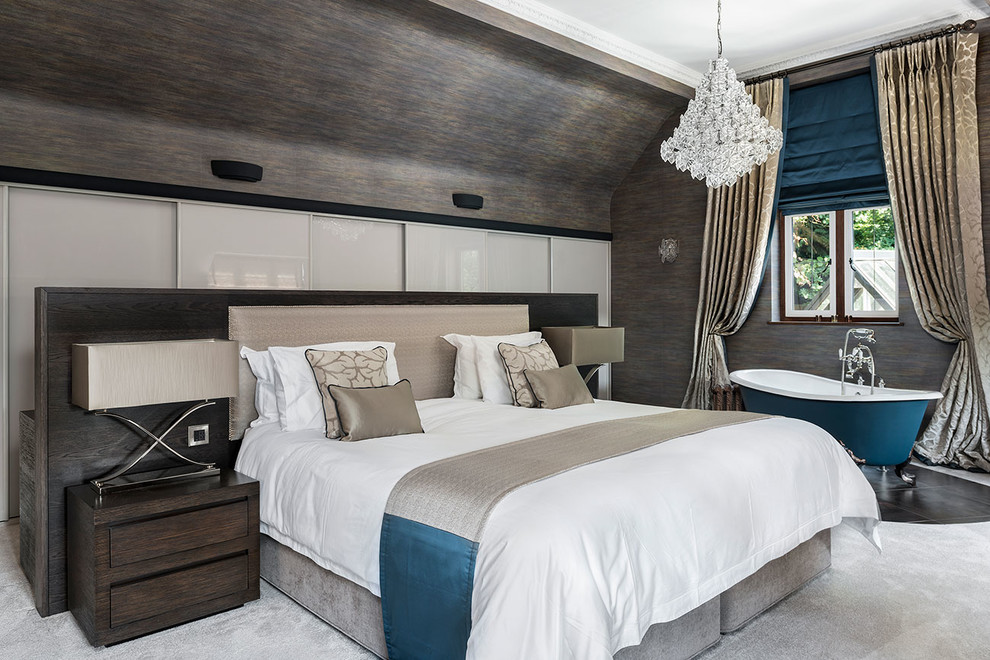 Inspiration for an expansive contemporary master bedroom in Surrey with multi-coloured walls, carpet and beige floors.