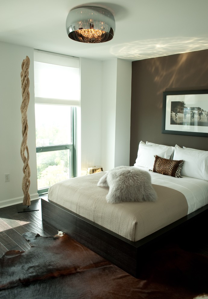 Inspiration for a mid-sized contemporary master dark wood floor bedroom remodel in Atlanta with brown walls