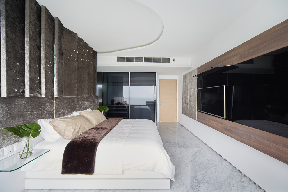 Inspiration for a small modern master bedroom in Singapore with beige walls.