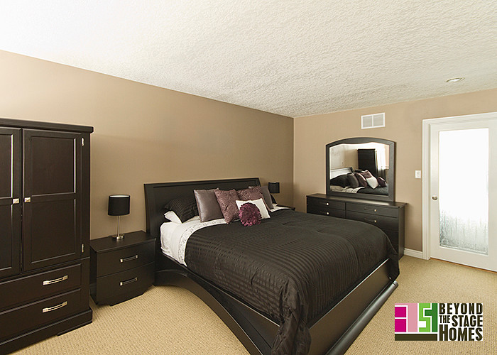 Example of a transitional bedroom design in Toronto