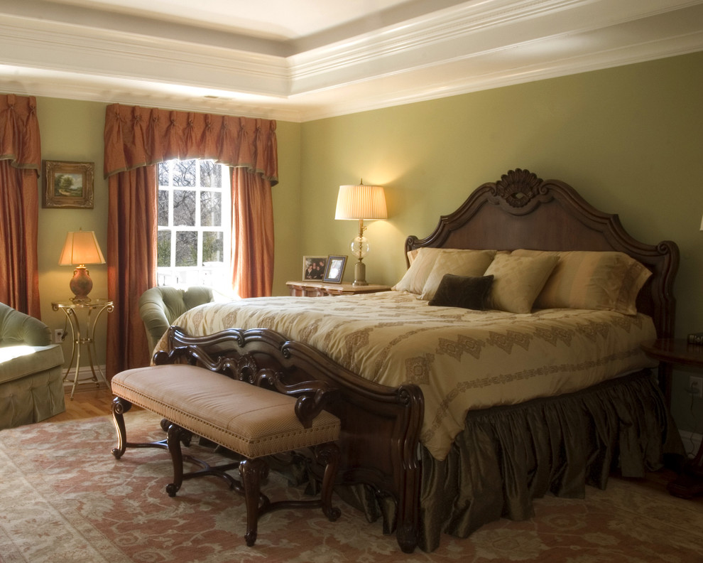 Inspiration for a traditional bedroom in Atlanta with green walls.