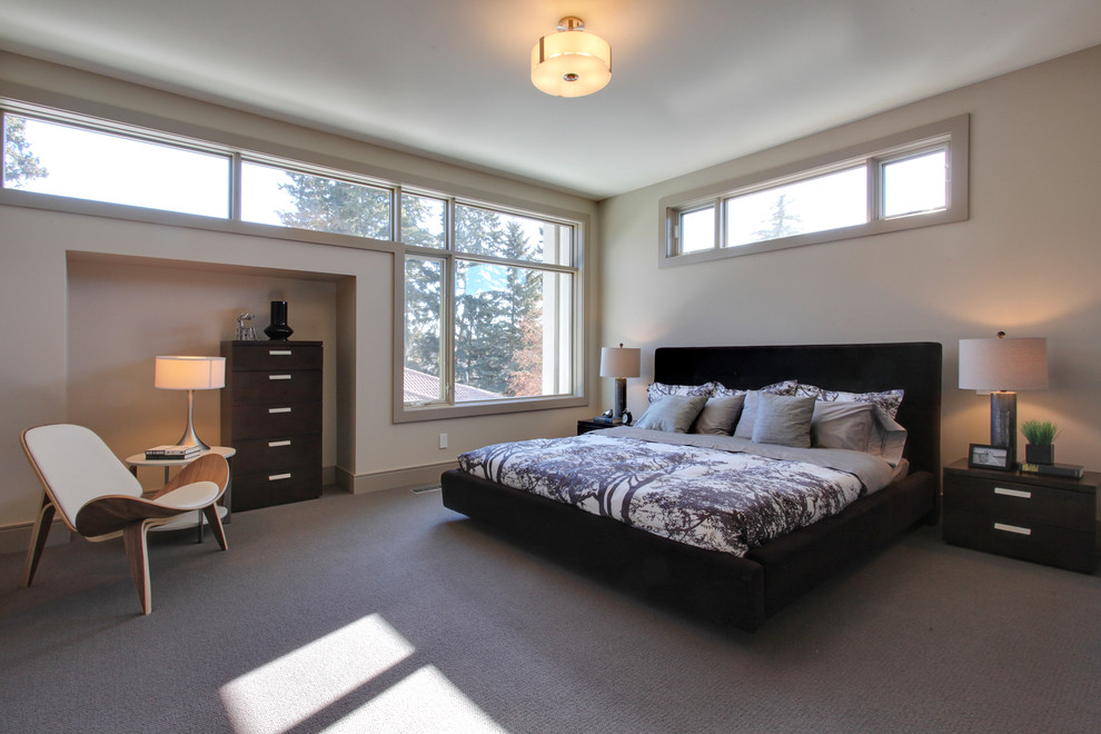 Inspiration for a contemporary bedroom in Calgary with white walls, carpet and no fireplace.