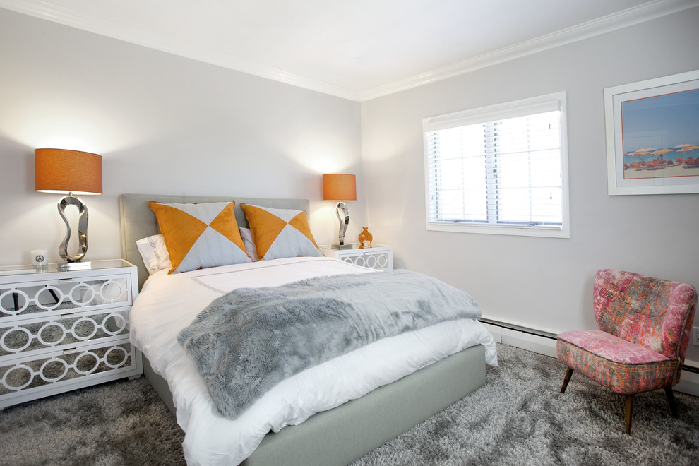 Imagen de habitación de invitados actual de tamaño medio sin chimenea con paredes grises y moqueta