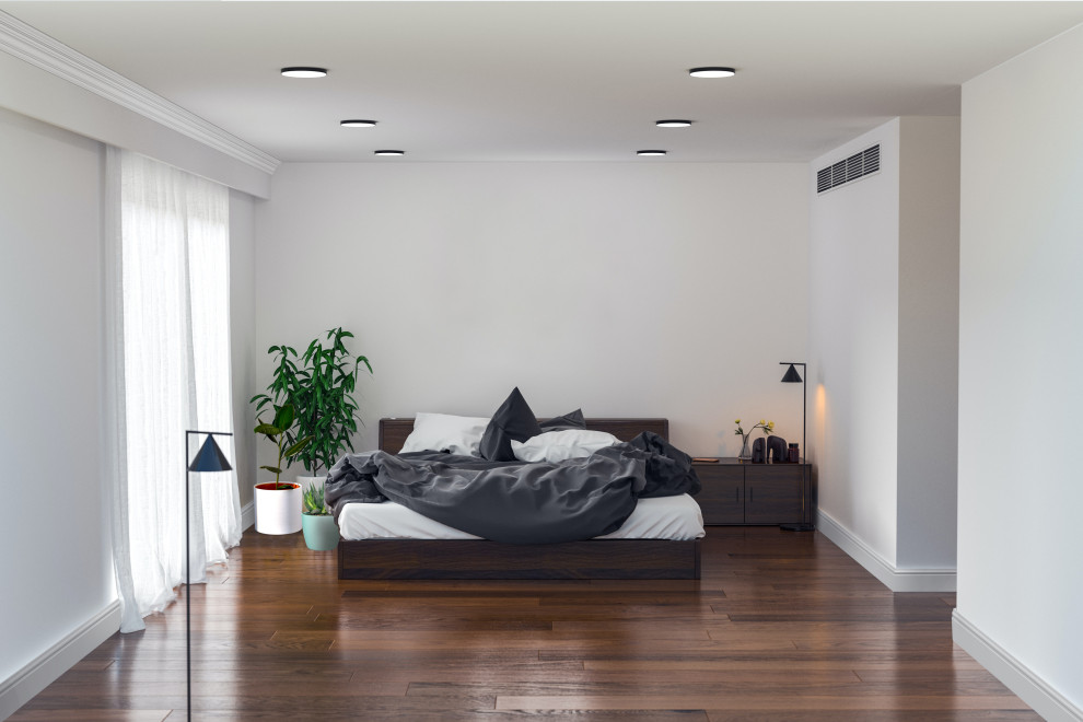 Diseño de dormitorio principal actual de tamaño medio sin chimenea con paredes blancas, suelo de madera oscura y suelo marrón