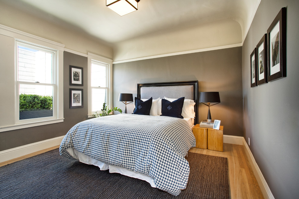 This is an example of a contemporary bedroom in San Francisco with grey walls.