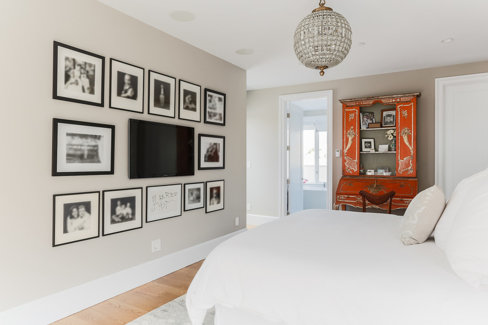 Bedroom - contemporary light wood floor bedroom idea in San Francisco with beige walls