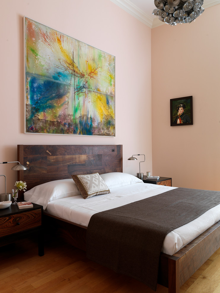 Contemporary master bedroom in New York with pink walls.
