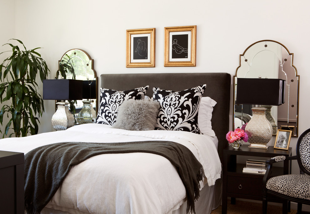 Example of a trendy bedroom design in Boise with white walls and no fireplace