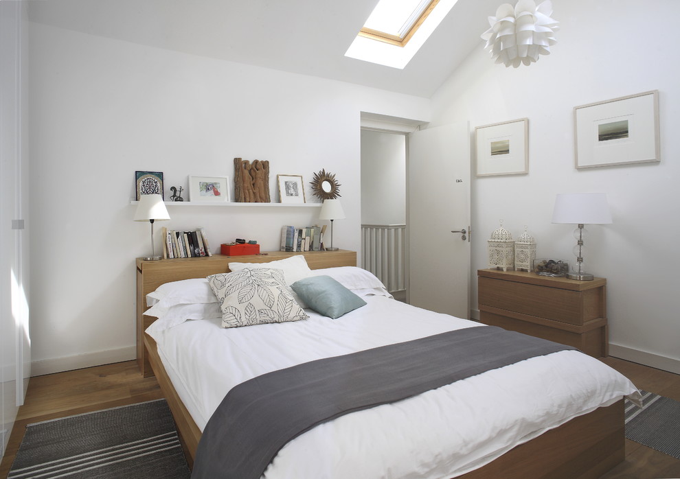 Contemporary bedroom in Dublin with white walls.