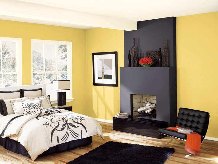 Inspiration for a contemporary master light wood floor bedroom remodel in Vancouver with yellow walls