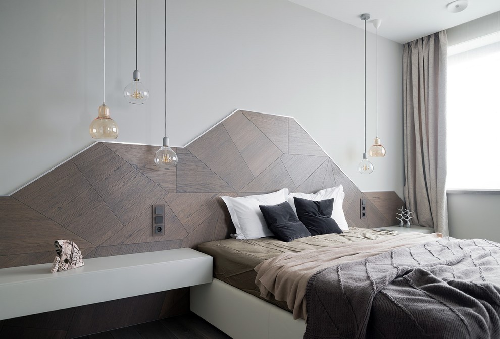 Modern inredning av ett sovrum, med grå väggar