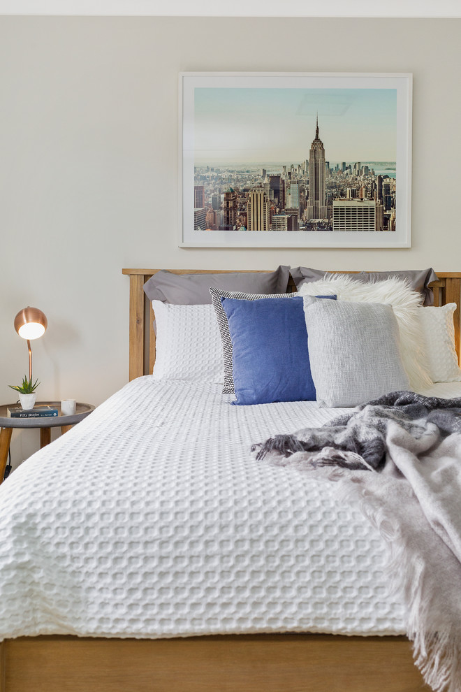 This is an example of a contemporary bedroom in Hobart with grey walls.