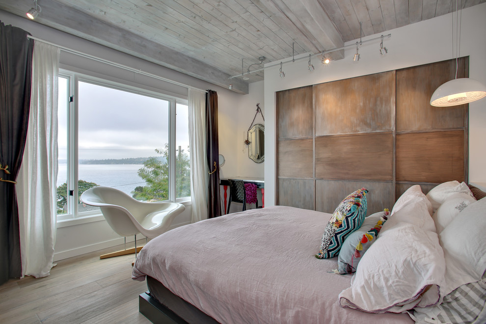 This is an example of a contemporary master bedroom in Seattle.