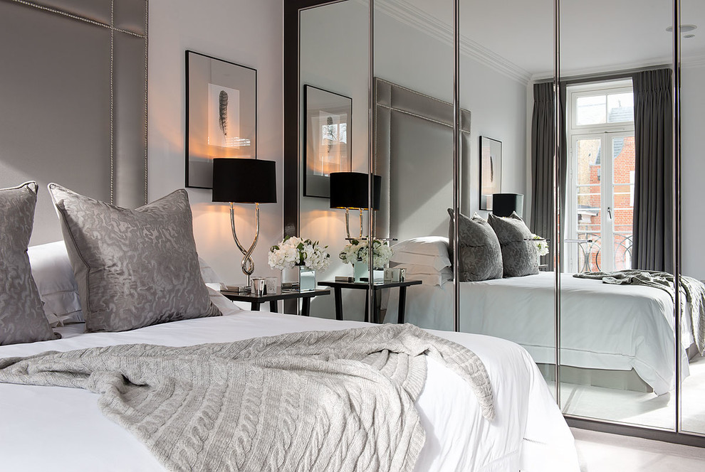 This is an example of a contemporary grey and silver bedroom in Surrey.
