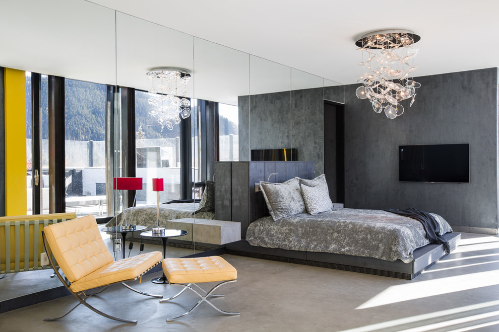 Inspiration för moderna sovrum, med grå väggar och betonggolv