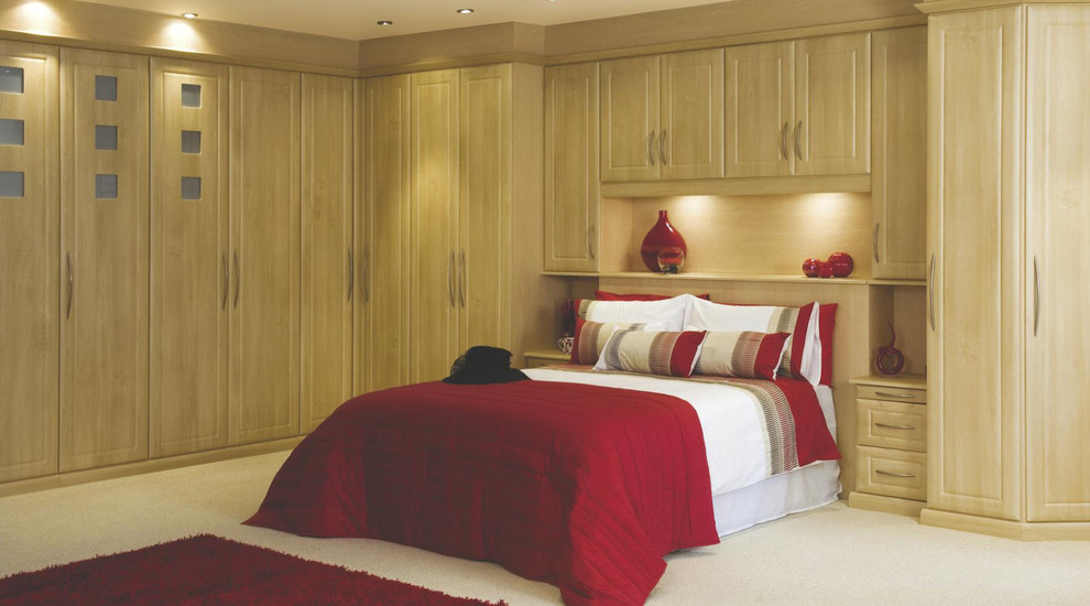 Inspiration for a large contemporary master bedroom in Hampshire with carpet.