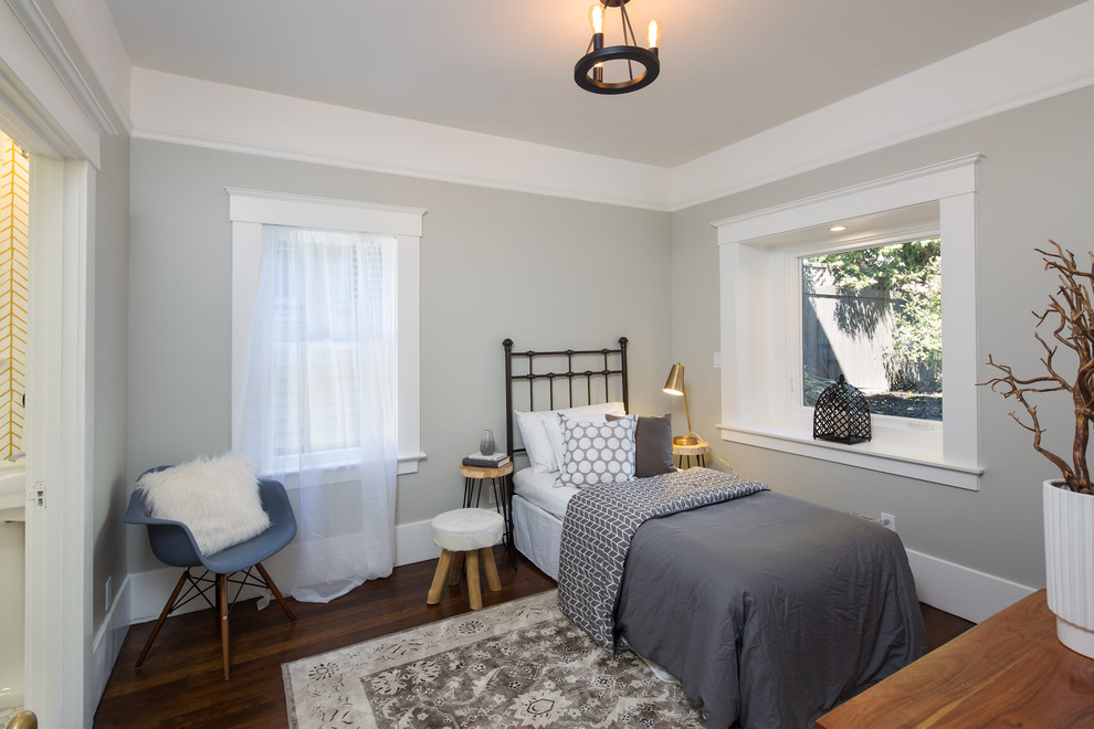 This is an example of a contemporary guest bedroom in San Francisco with grey walls and dark hardwood flooring.