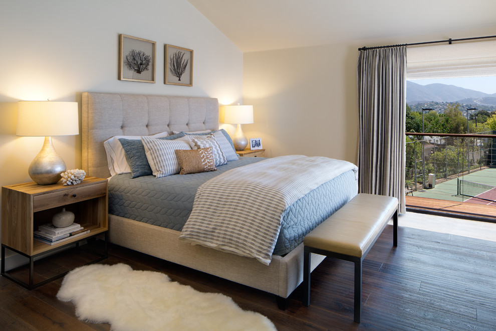 This is an example of a contemporary master bedroom in San Diego with dark hardwood flooring.