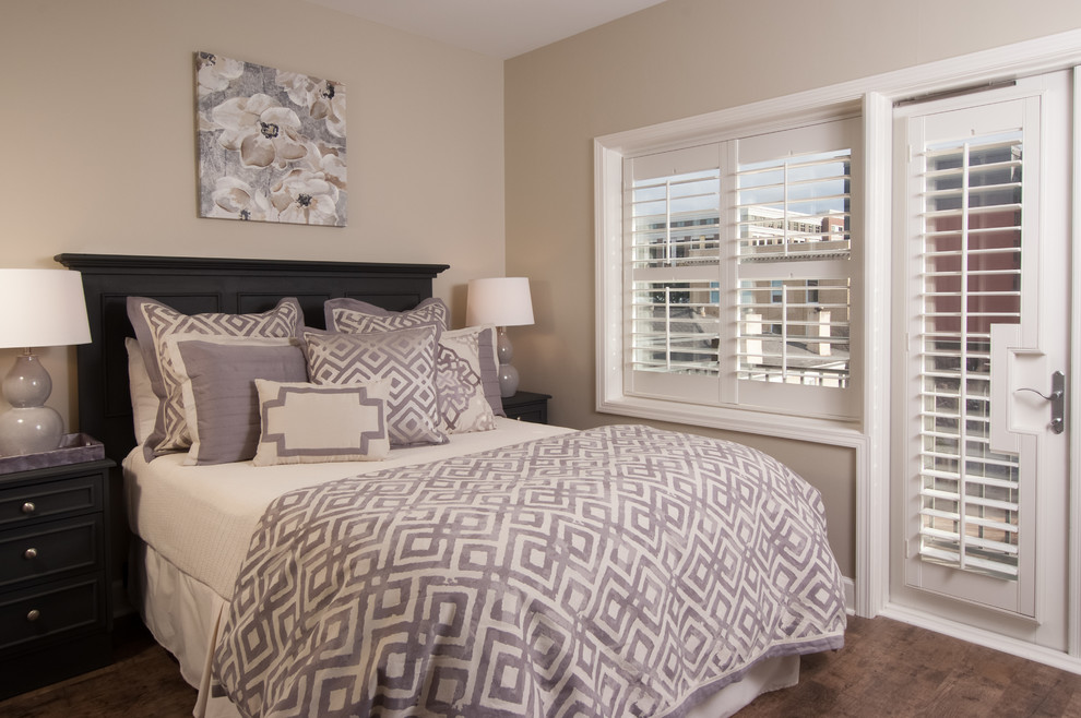 Small trendy master laminate floor bedroom photo in Atlanta with gray walls