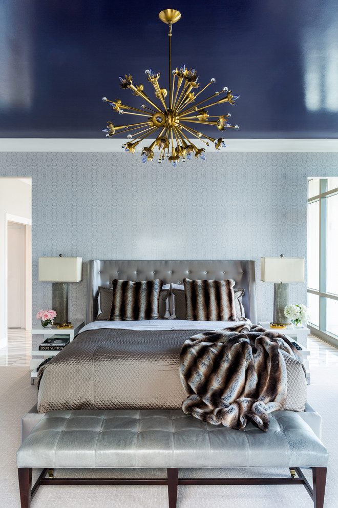 Example of a trendy master bedroom design in Little Rock with blue walls