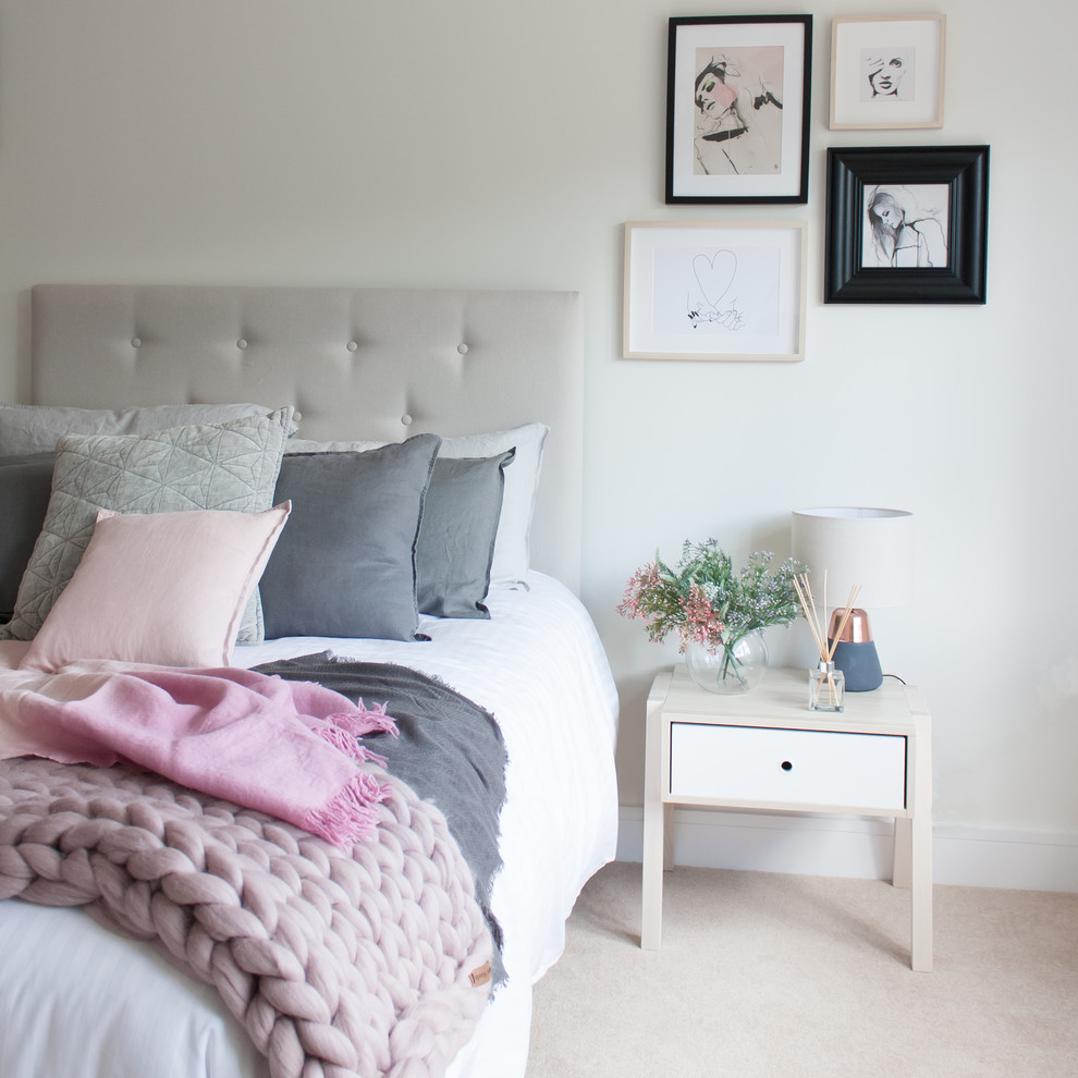 Photo of a medium sized modern guest and grey and pink bedroom in Hertfordshire with white walls, carpet and beige floors.