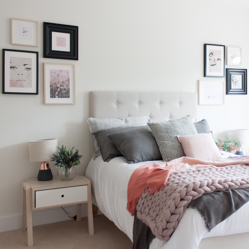 Design ideas for a medium sized modern grey and pink bedroom in Hertfordshire with white walls, carpet and beige floors.