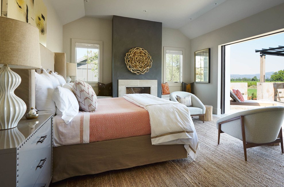 Example of a large transitional master bedroom design in San Francisco with white walls, a standard fireplace and a concrete fireplace