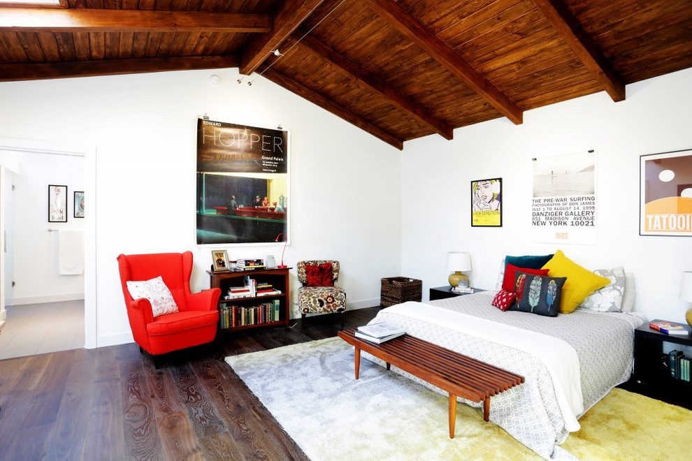 Cottage brown floor and medium tone wood floor bedroom photo in Los Angeles with white walls