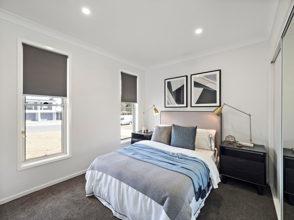 Exemple d'une chambre avec moquette tendance de taille moyenne avec un mur gris et un sol gris.