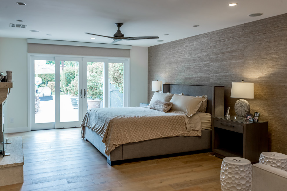 Inspiration for a large contemporary master medium tone wood floor and white floor bedroom remodel in San Francisco with white walls