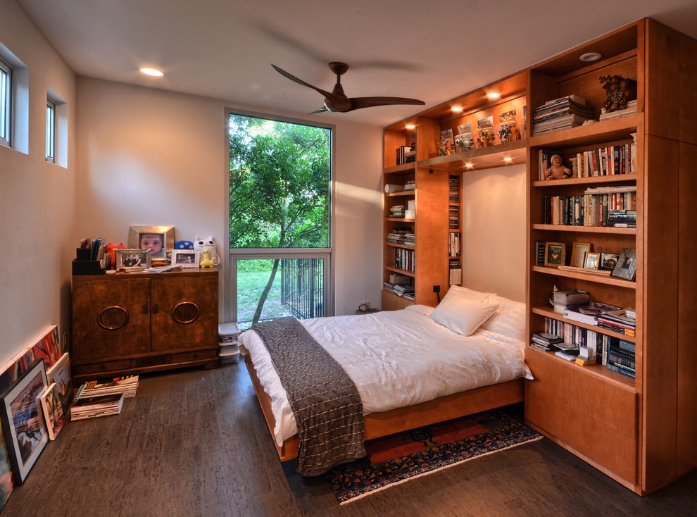 Inspiration for a mid-sized contemporary guest dark wood floor bedroom remodel in Austin with beige walls