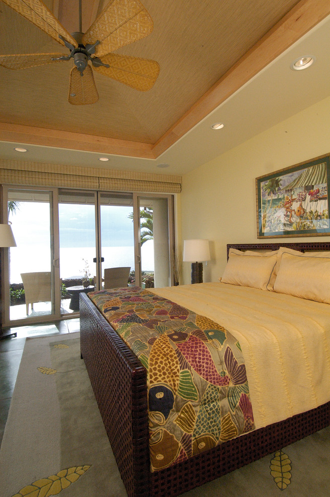 Inspiration for a medium sized contemporary master bedroom in Hawaii with yellow walls and concrete flooring.